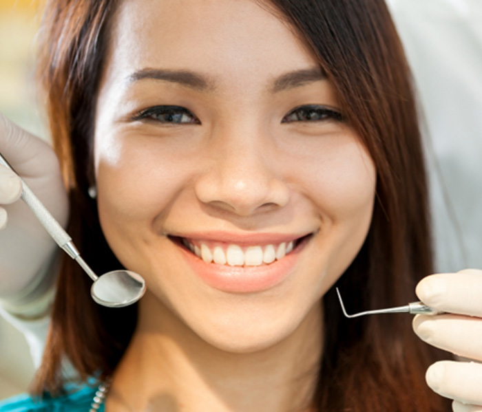 Patient in Fort Lee smiling with dental crown
