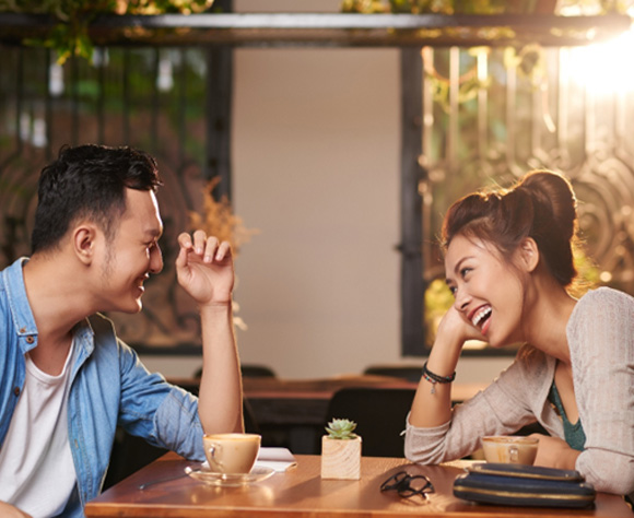 Happy Fort Lee patient on date at restaurant