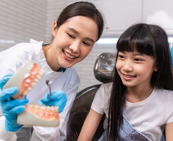 Dentist and child smiling