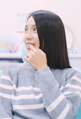 Patient in Englewood Cliffs smiling with missing tooth