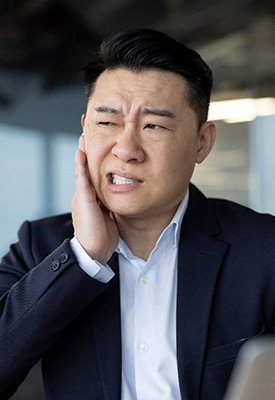 Patient in Englewood Cliffs holding their cheek