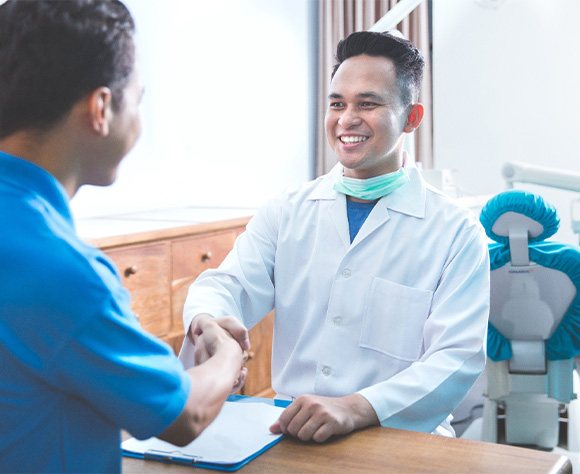 Man smiling at the dental office